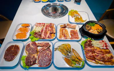 BBQ dinner spread with marinated meats and seafood on the Phu Quoc Sunset Tour.