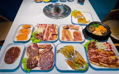 BBQ dinner spread with marinated meats and seafood on the Phu Quoc Sunset Tour.
