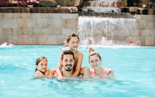 Ròseo Euroterme Thermal Pools, Rimini, Italy, with guests enjoying a relaxing swim before dinner.