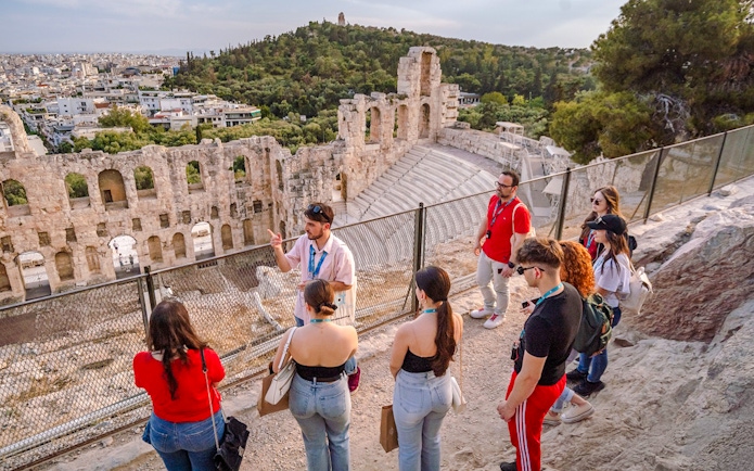 Guided group tour at Odeon of Herodes Atticus amphitheater in Athens, Greece.