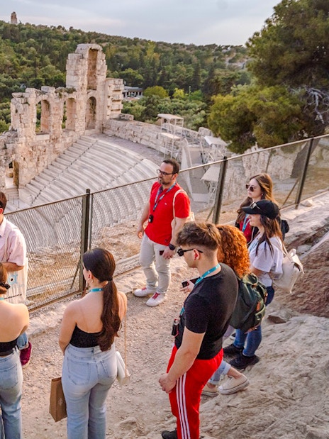 Guided group tour at Odeon of Herodes Atticus amphitheater in Athens, Greece.
