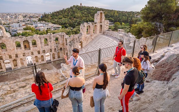 Guided group tour at Odeon of Herodes Atticus amphitheater in Athens, Greece.