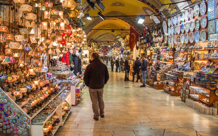 Grand Bazaar in Istanbul with colorful lamps and ceramics on display.