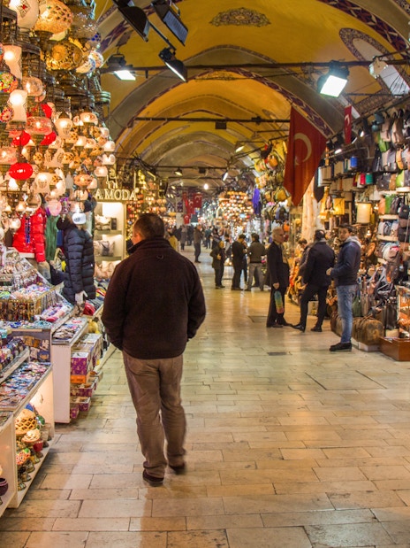 Grand Bazaar in Istanbul with colorful lamps and ceramics on display.