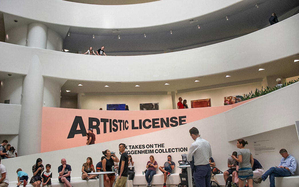 Visitors inside the Guggenheim Museum, New York, near the "Artistic License" exhibit.