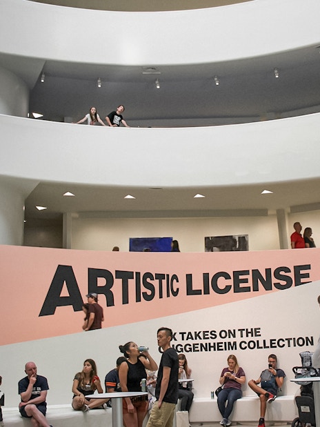 Visitors inside the Guggenheim Museum, New York, near the "Artistic License" exhibit.