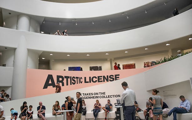 Visitors inside the Guggenheim Museum, New York, near the "Artistic License" exhibit.