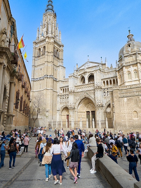 Visitors exploring Toledo Cathedral with a guide in Spain.