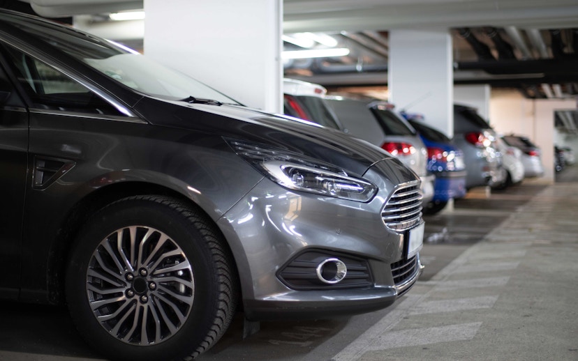 Cars parked in an indoor parking garage.