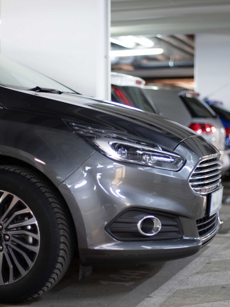 Cars parked in an indoor parking garage.