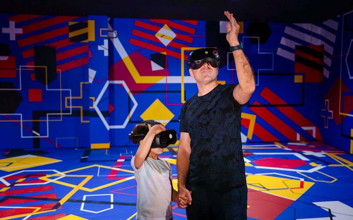 Visitors using VR headsets at Spotify Camp Nou Barça Museum exhibit.