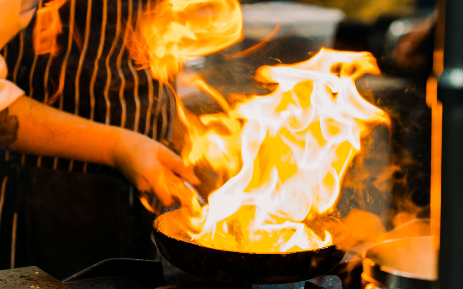 Chef flambéing dish at Fonseca Port Wine Cellars.