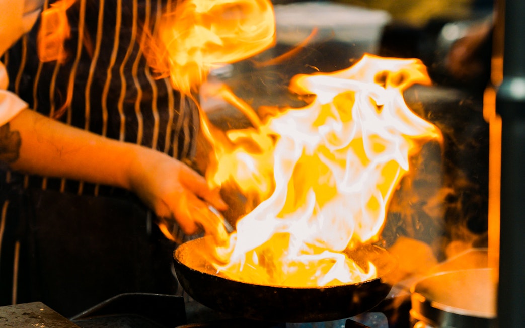 Chef flambéing dish at Fonseca Port Wine Cellars.