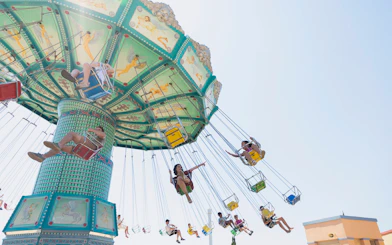 Swing ride at Terra Mitica Benidorm with people enjoying the attraction.