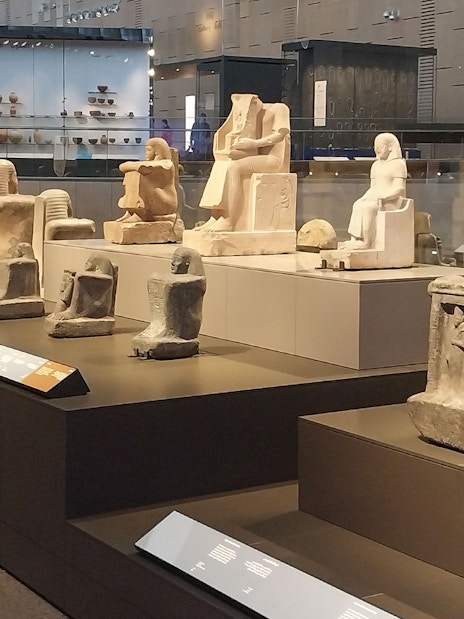 Ancient Egyptian statues displayed at the Grand Egyptian Museum.