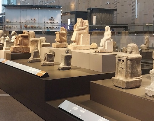 Ancient Egyptian statues displayed at the Grand Egyptian Museum.