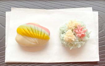 Japanese traditional sweets wagashi with colorful designs on a white napkin.