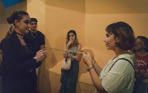 Participants engaging in a Ghost Walking Tour of Rome, discussing paranormal activity.
