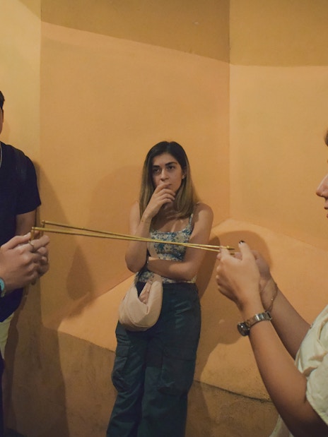 Participants engaging in a Ghost Walking Tour of Rome, discussing paranormal activity.