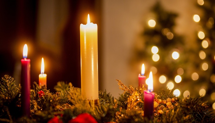 Candles lit for Christmas service at Canterbury Cathedral.