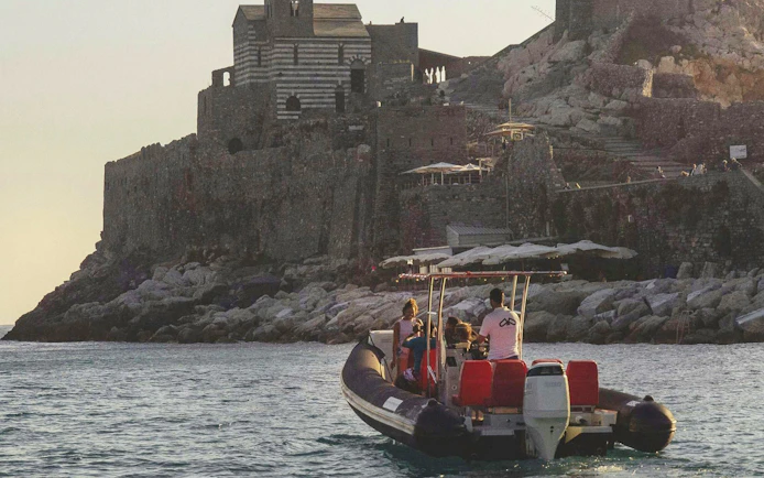Boat approaching Portovenere's historic church on La Spezia: Portovenere and 3 Islands tour.