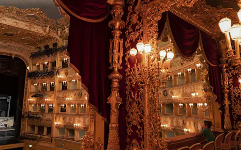 Teatro La Fenice interior with ornate balconies and stage, Venice.