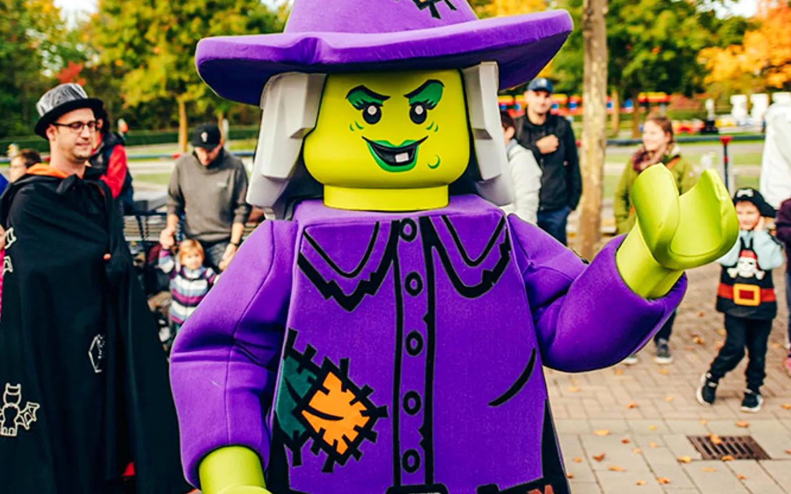 Lego witch character entertaining visitors at Halloween event in Legoland Billund.