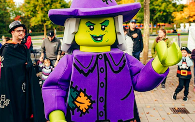 Lego witch character entertaining visitors at Halloween event in Legoland Billund.