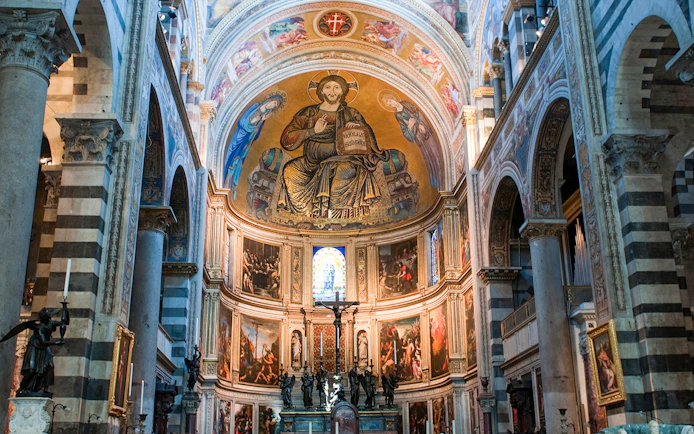 Interior of Pisa Cathedral with ornate frescoes and arches, part of the Small-Group Guided Tour.