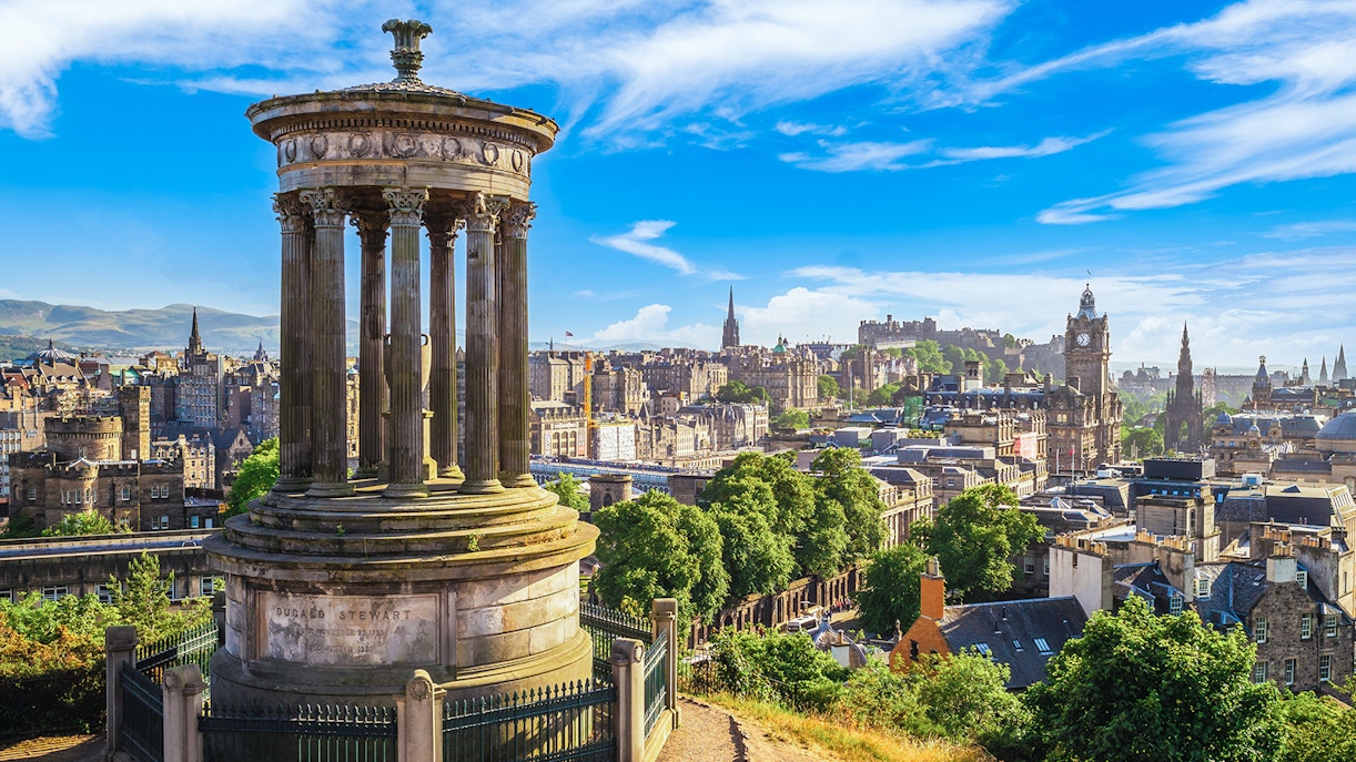 Calton Hill with Dugald Stewart Monument overlooking Edinburgh, Scotland.