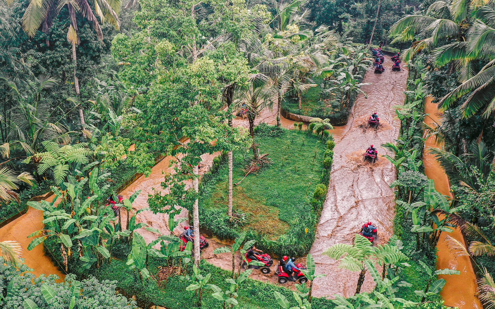 ATVs driving through lush jungle trails in Ubud, Bali.