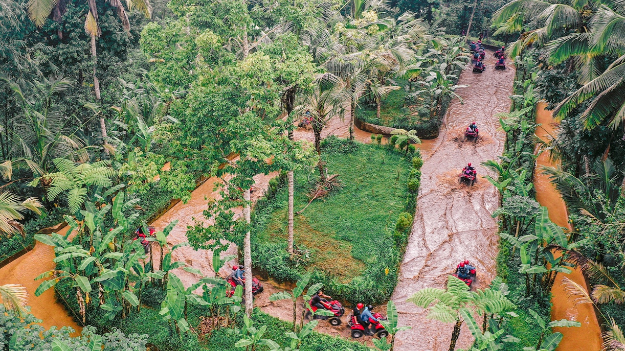 ATVs driving through lush jungle trails in Ubud, Bali.