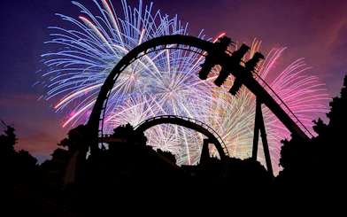 Roller coaster silhouette with fireworks at Busch Gardens Williamsburg.