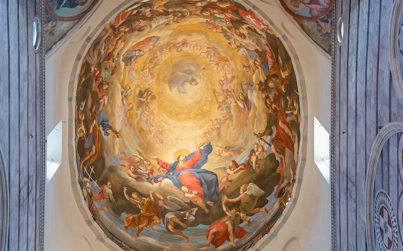 Interior fresco of Pisa Cathedral dome depicting religious figures and celestial scene.