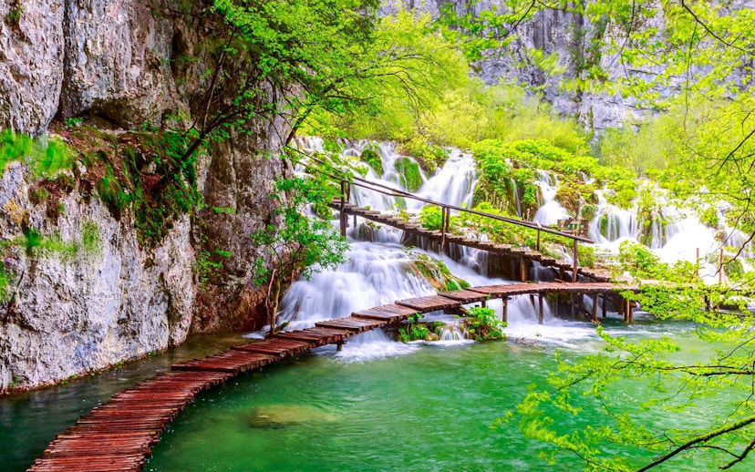 Wooden path over waterfalls at Plitvice Lakes National Park, Croatia.