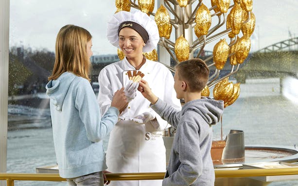 Visitors sampling chocolate at the Chocolate Museum in Cologne.