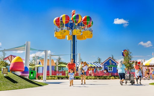 Family enjoying a day at Peppa Pig Park in Günzburg with colorful rides and attractions.
