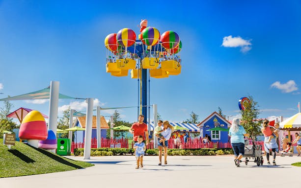 Family enjoying a day at Peppa Pig Park in Günzburg with colorful rides and attractions.