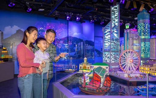 Family enjoying LEGO Hong Kong skyline display at LEGOLAND® Discovery Centre Hong Kong.