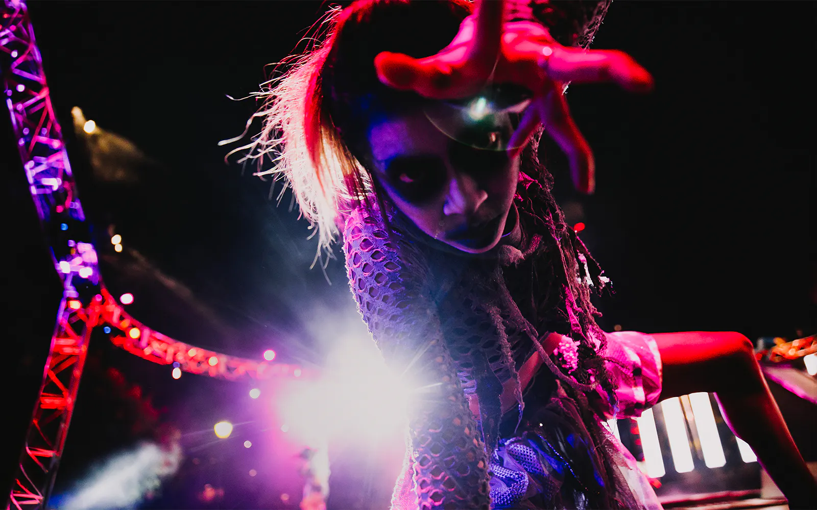 SCarowinds performer at Six Flags Snicker's Halloween event with dramatic lighting.