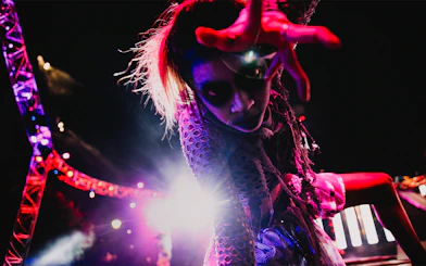 SCarowinds performer at Six Flags Snicker's Halloween event with dramatic lighting.