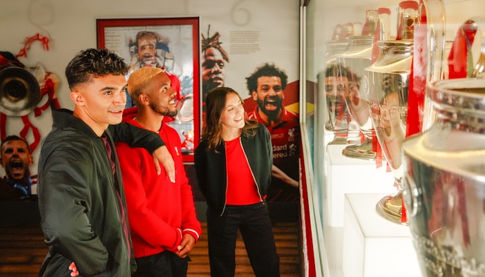 Guests viewing trophies at Liverpool Football Club Museum.