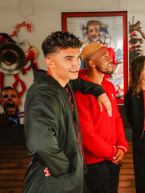Guests viewing trophies at Liverpool Football Club Museum.