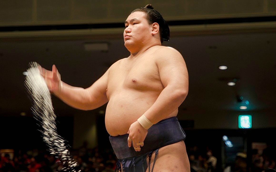 Sumo wrestler performing salt ceremony in Japan.