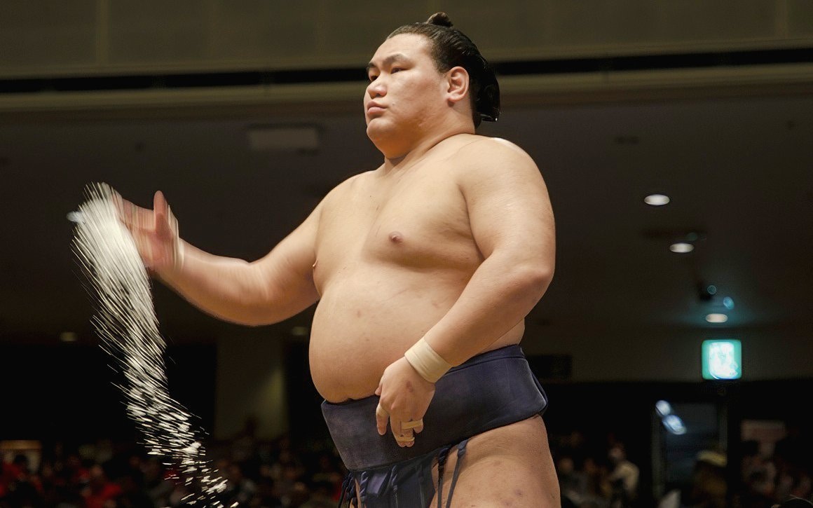 Sumo wrestler performing salt ceremony in Japan.