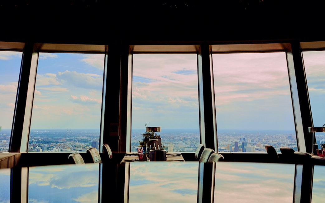 View from Berlin TV Tower restaurant overlooking cityscape.