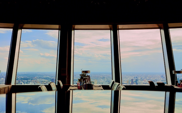 View from Berlin TV Tower restaurant overlooking cityscape.