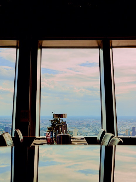 View from Berlin TV Tower restaurant overlooking cityscape.