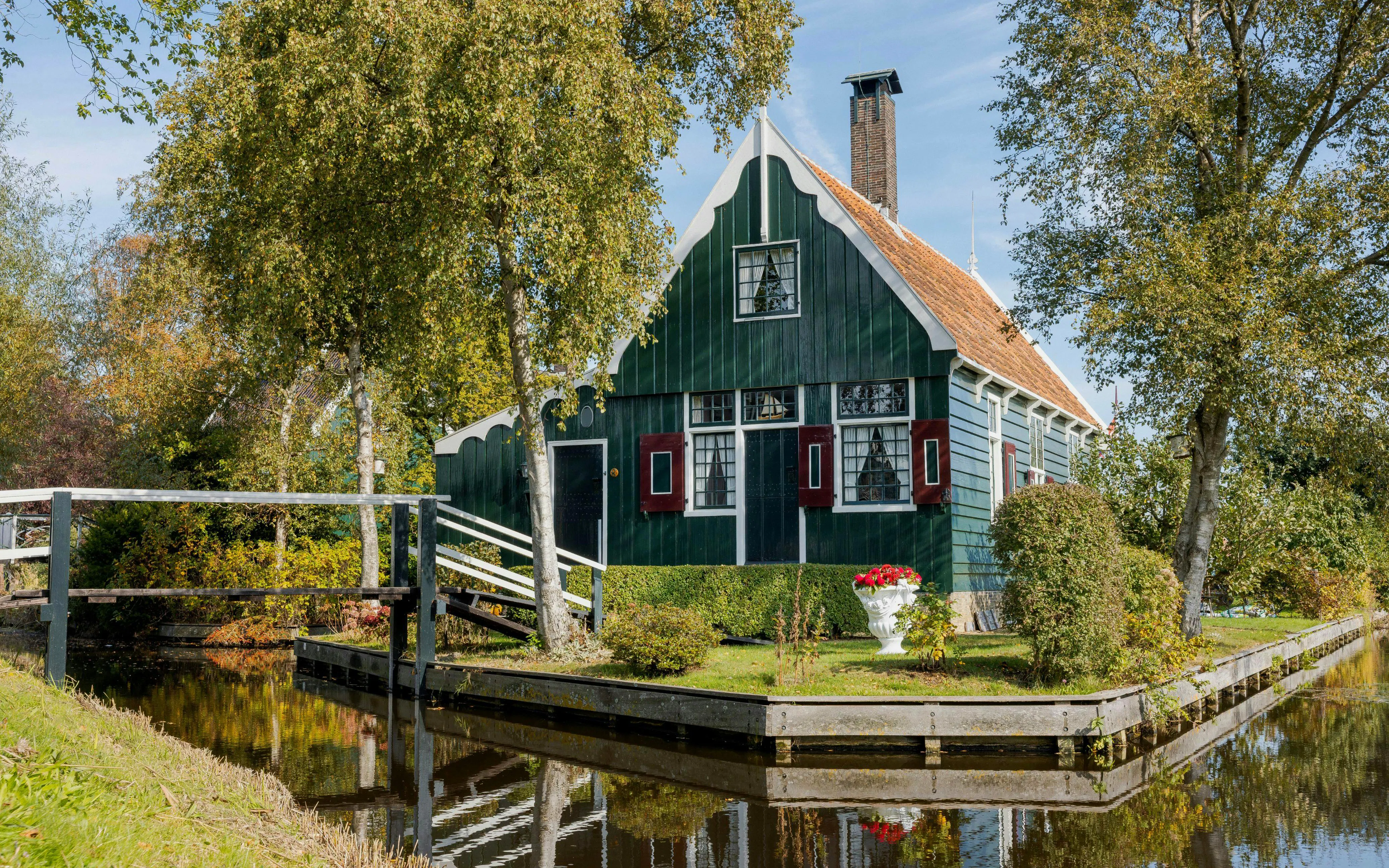 Traditional Dutch house by a canal in Zaanse Schans, Netherlands.