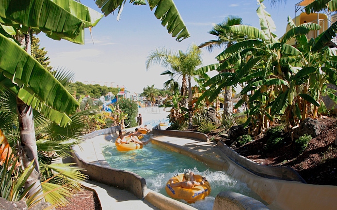 Visitors enjoying a lazy river ride at Aquopolis Costa Daurada, Tarragona water park.